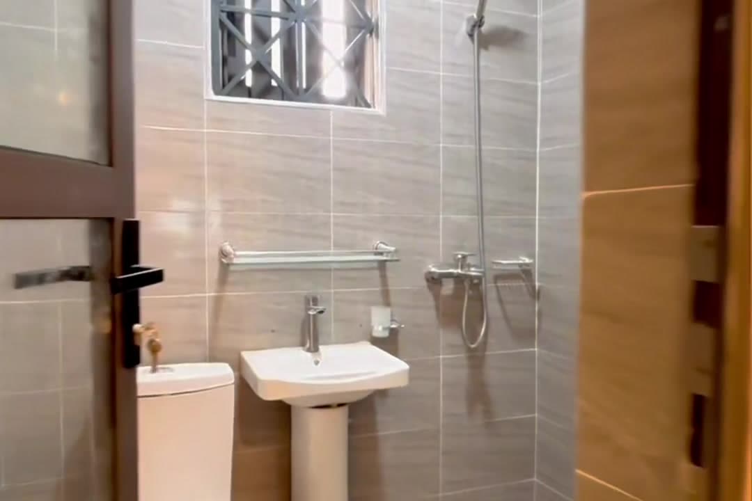 Tiled bathroom with a walk-in shower