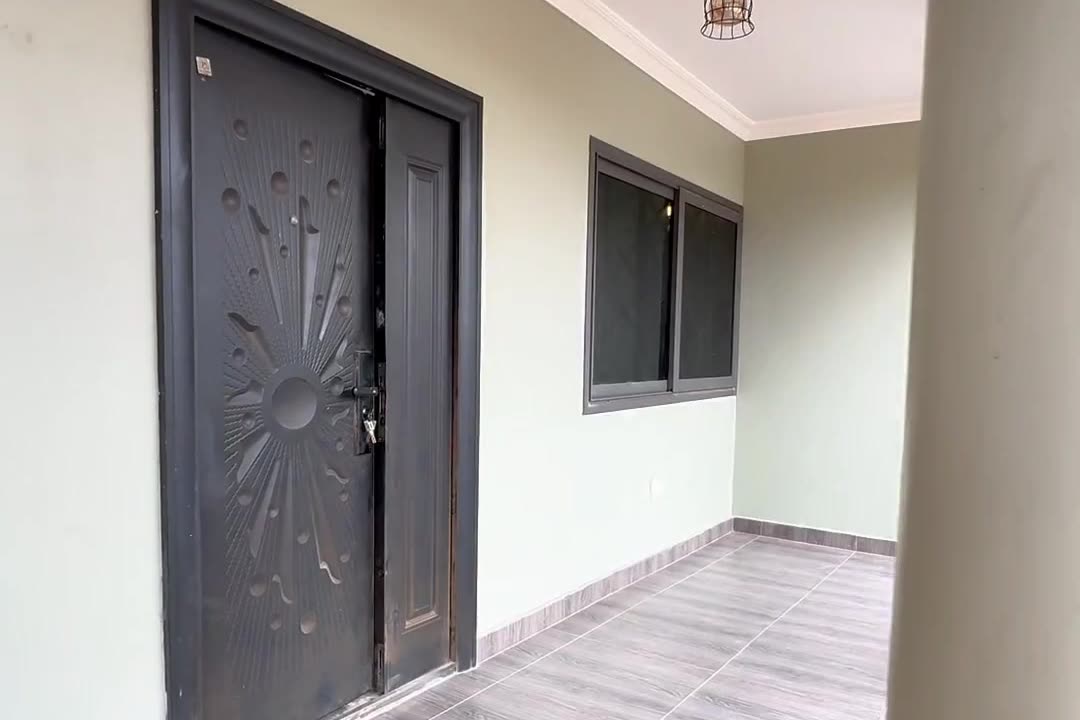 Entrance veranda with a carved front door